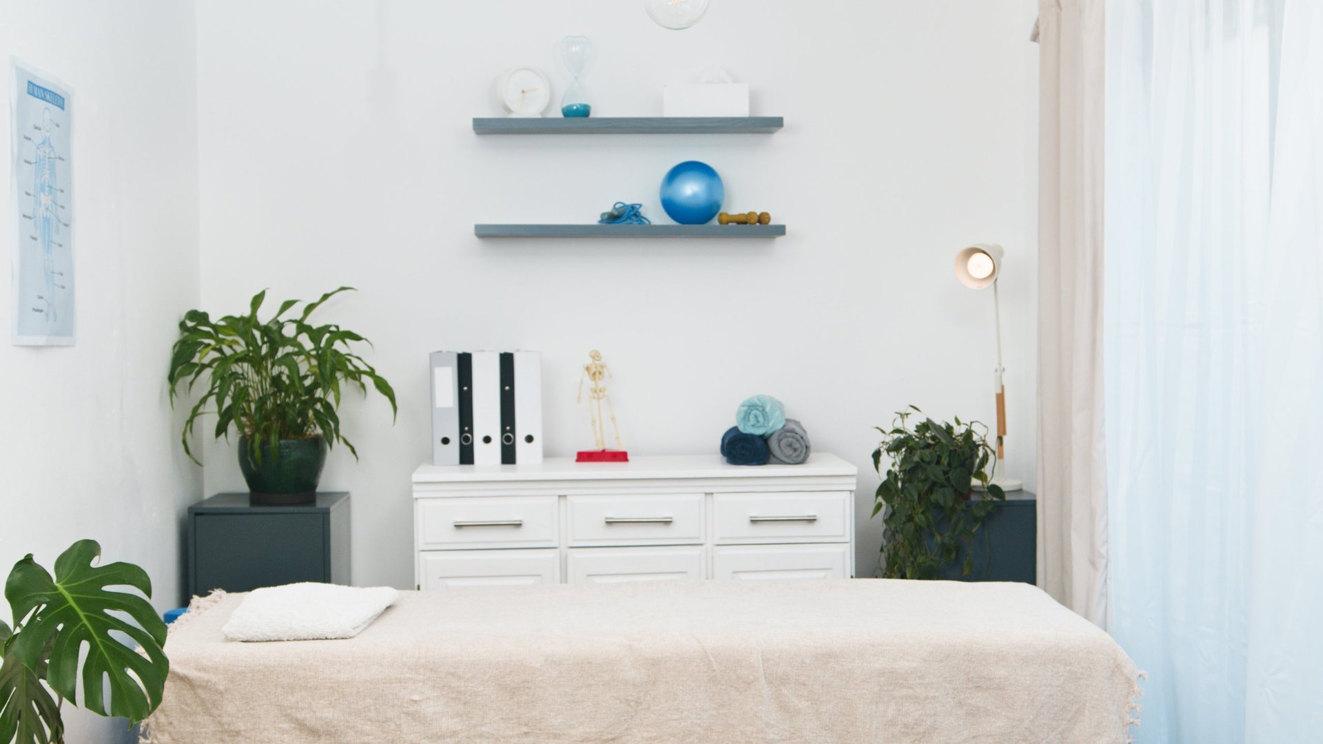 A bright and organized physiotherapy clinic room for patient consultations and rehabilitation